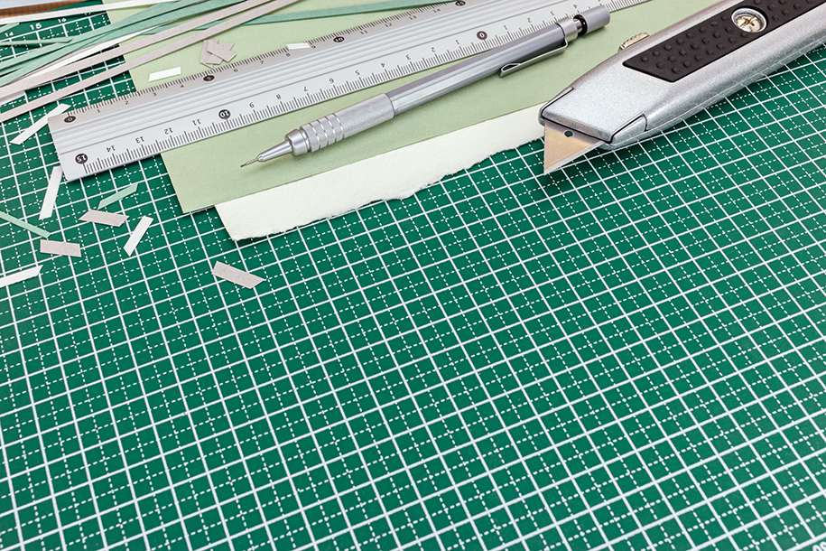 Cutting mat with knife, pencil and ruler